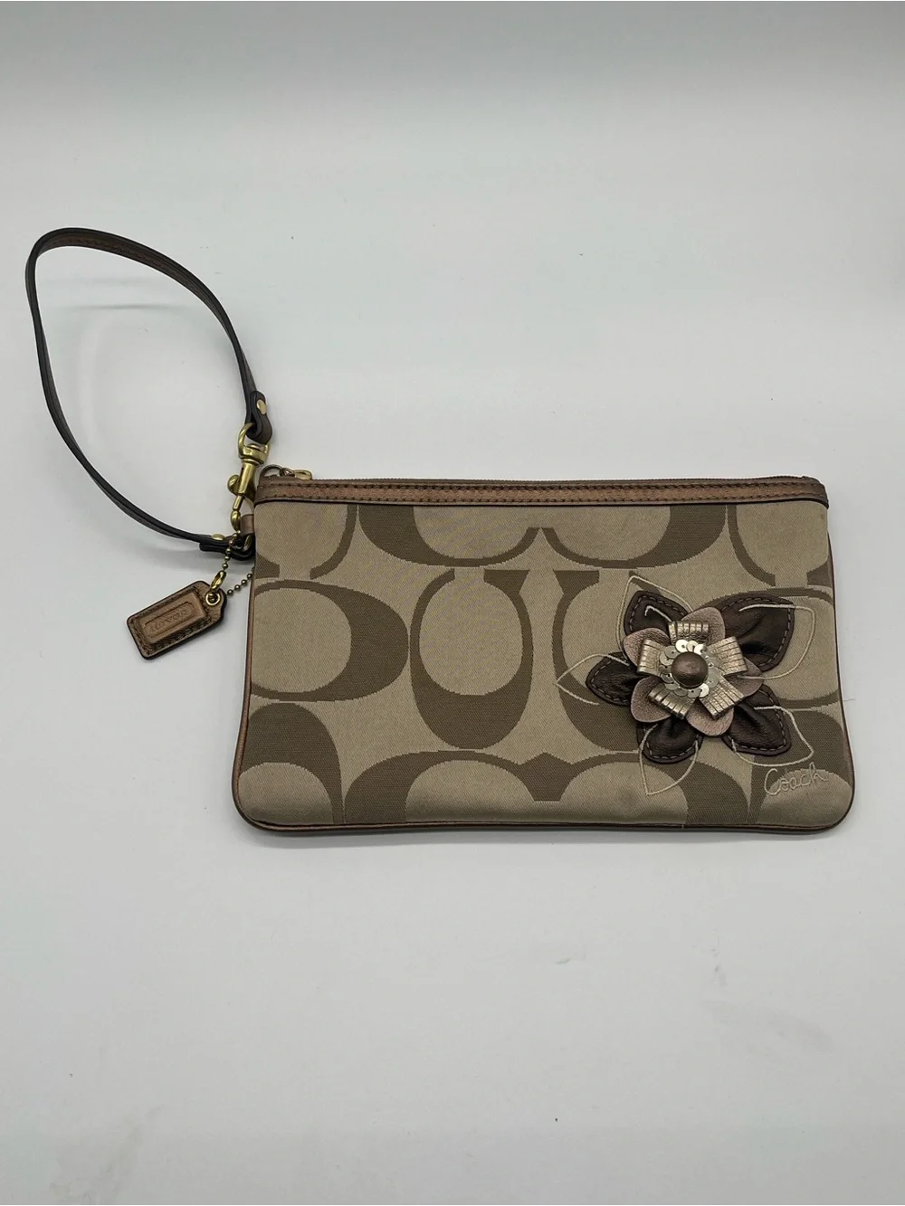 Coach Signature Logo khaki canvas and leather wristlet with 3D flower appliqué